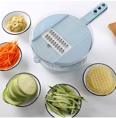 Vegetable slicer with sliced vegetables on a white surface